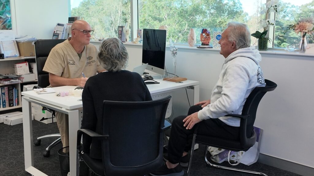Dr Darren Patterson attending to patient appointment