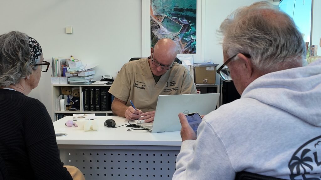 Dr Darren Patterson attending to patient appointment