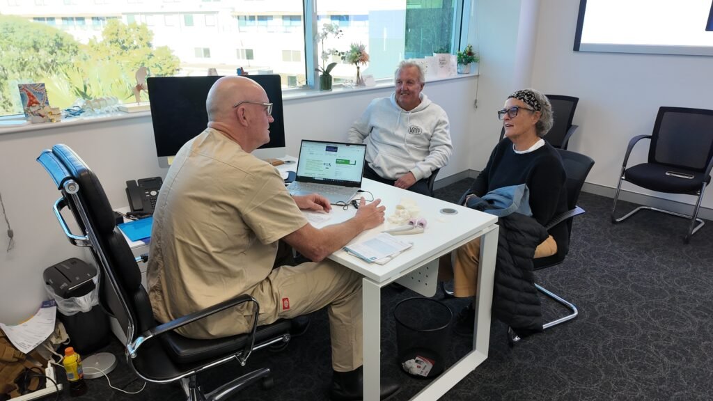 Dr Darren Patterson attending to patient appointment